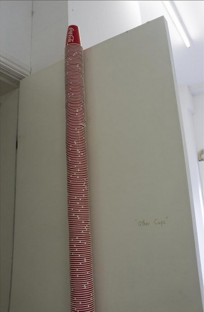 (Image 2 of 2) Site specific installation with 373 Coca Cola cups, door